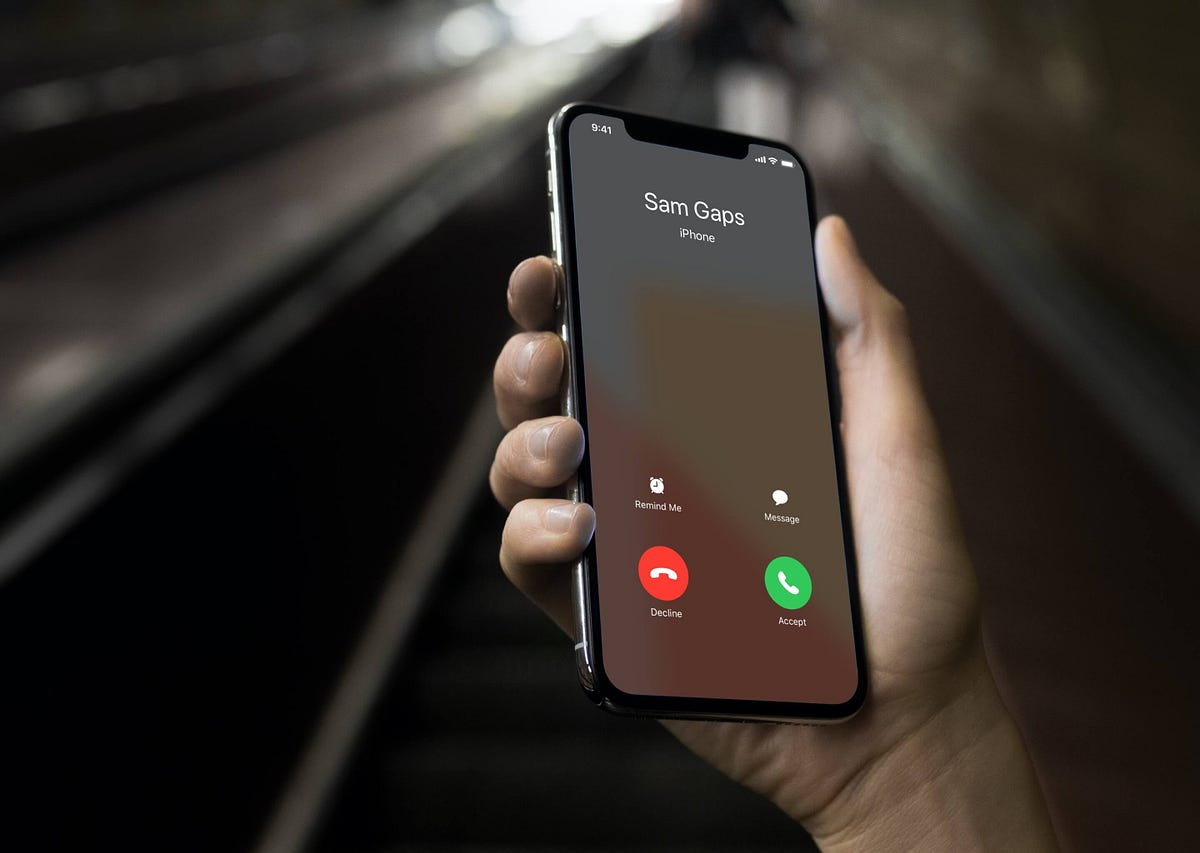Hand holding cell phone that is being called